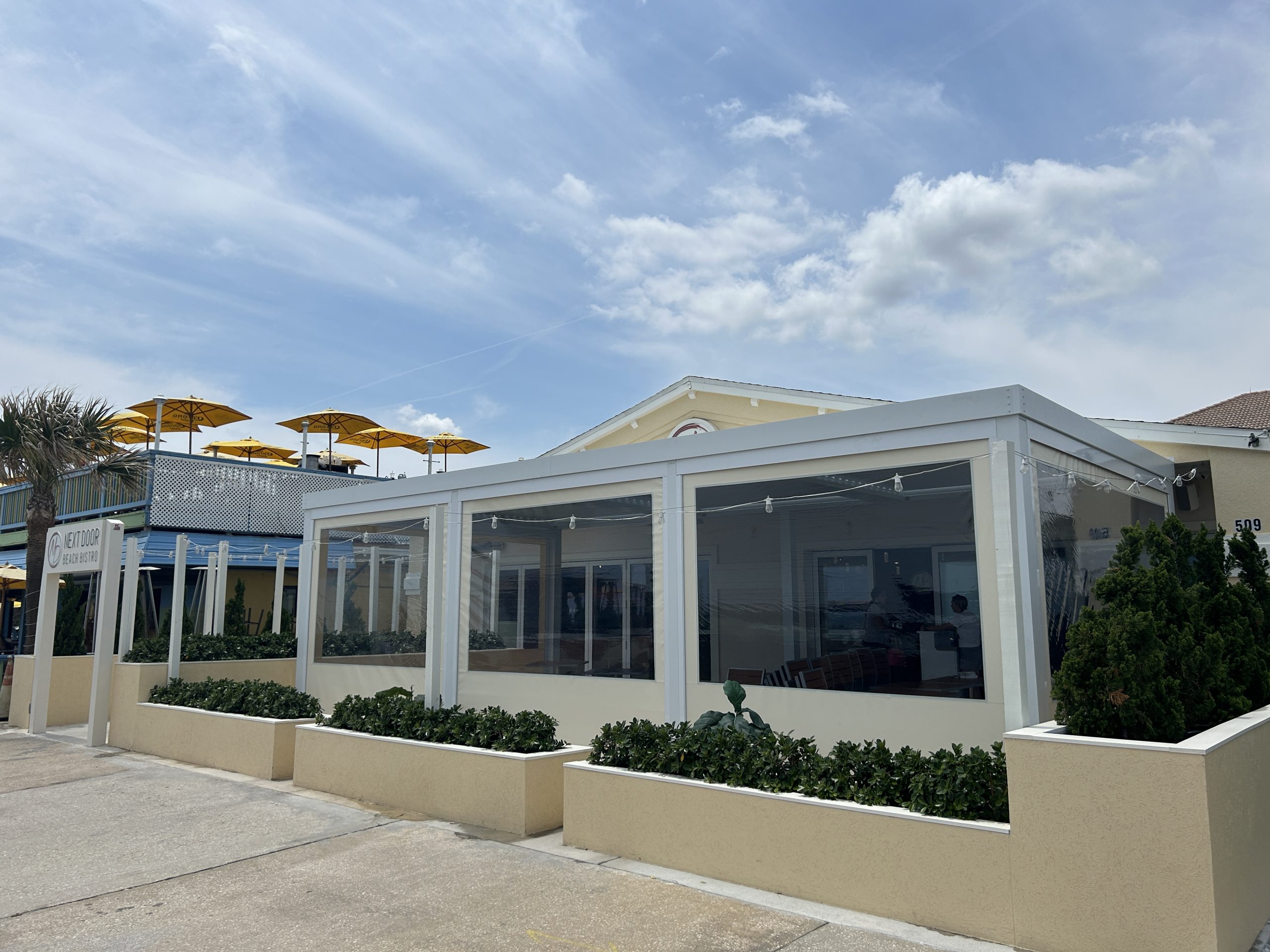 fenetex-clear-next-door-beach-bistro Our clear screens protect your space and keep customers comfortable without blocking your view. Call VPE today for more info